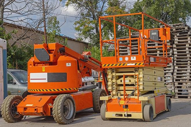 forklift carrying pallets in warehouse in Colesville